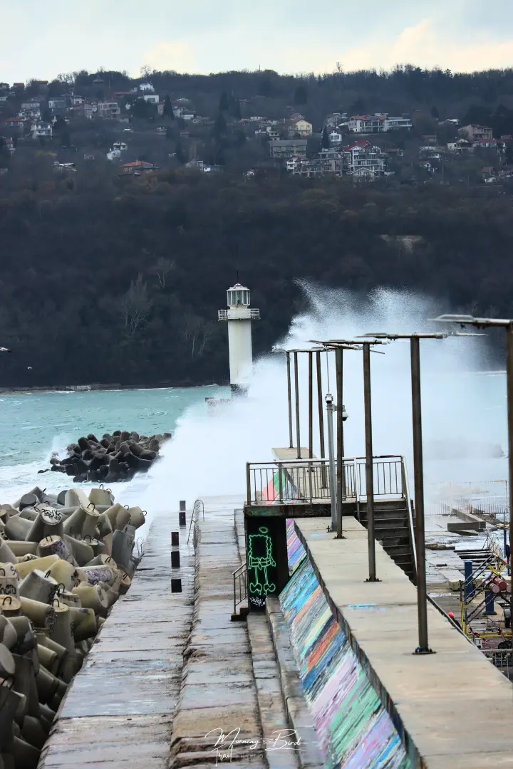 big waves hitting a lighthouse in Varna port, Bulgaria