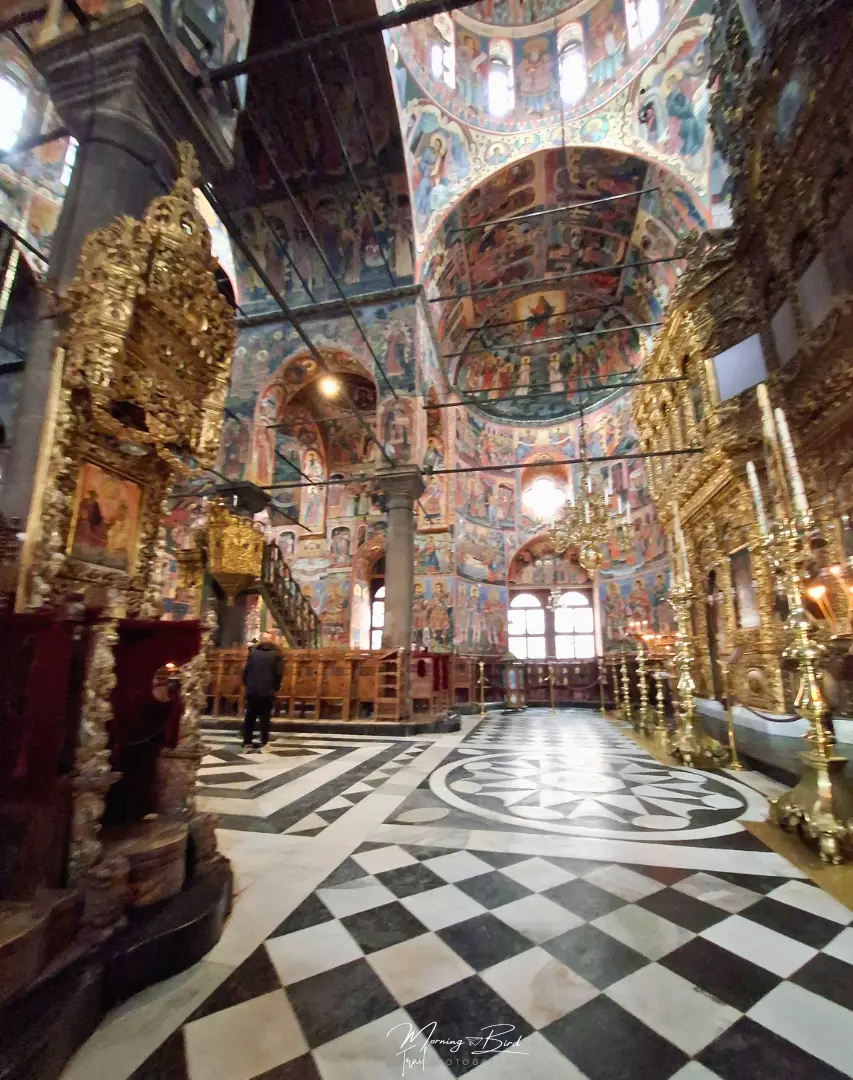 interior of Rila monastery with beautiful bulgarian paintings on the walls in pastel colours