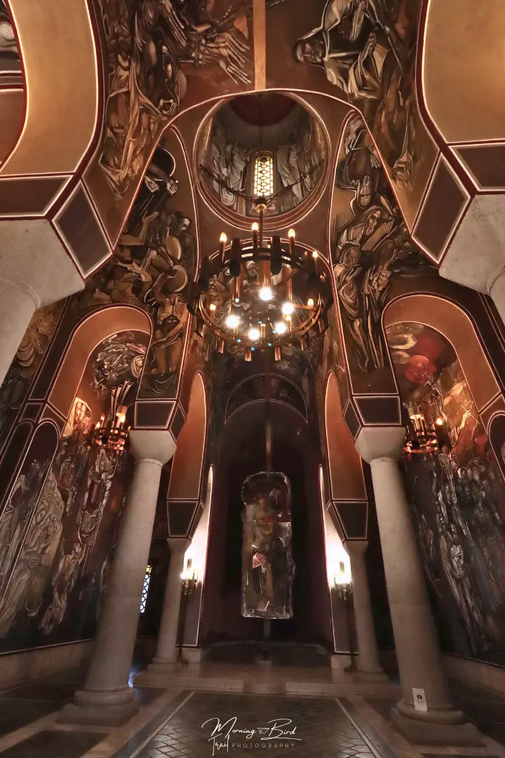 Inside of the church on top of the hill of the Tsarevets Fortress in Veliko Tarnovo, Bulgaria, with white columns and beautiful paintings on the walls