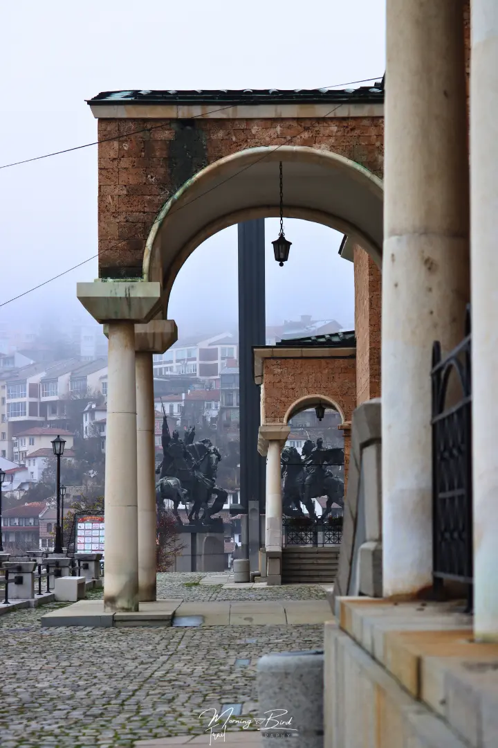 orange arches with Asen's Monument at the center